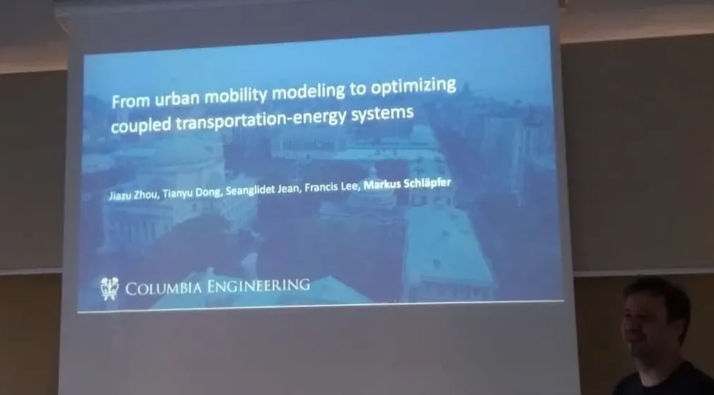 Presentation slide showing the coupling of urban mobility and energy systems.